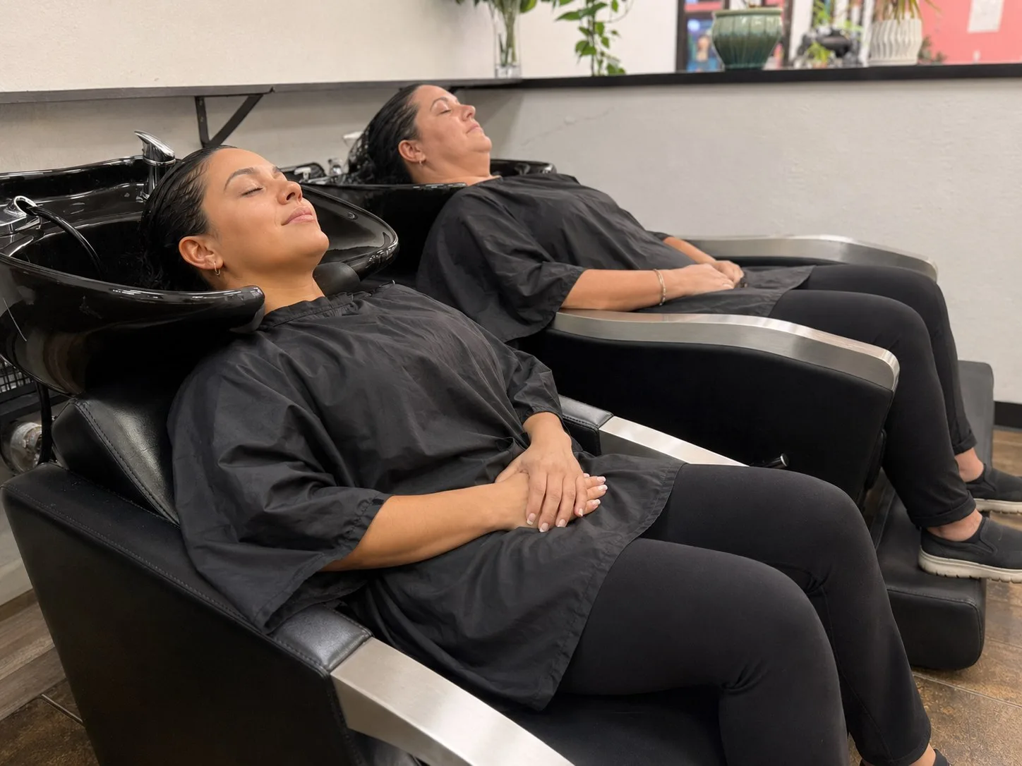 Clients relaxing at the shampoo wash lounge at PT Salon Pleasanton
